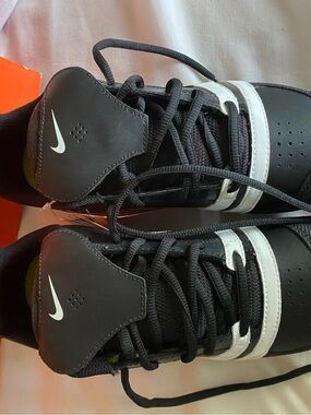 Nike Black and White fastpitch Diamond Slasher cleats with Neon Green Insole
